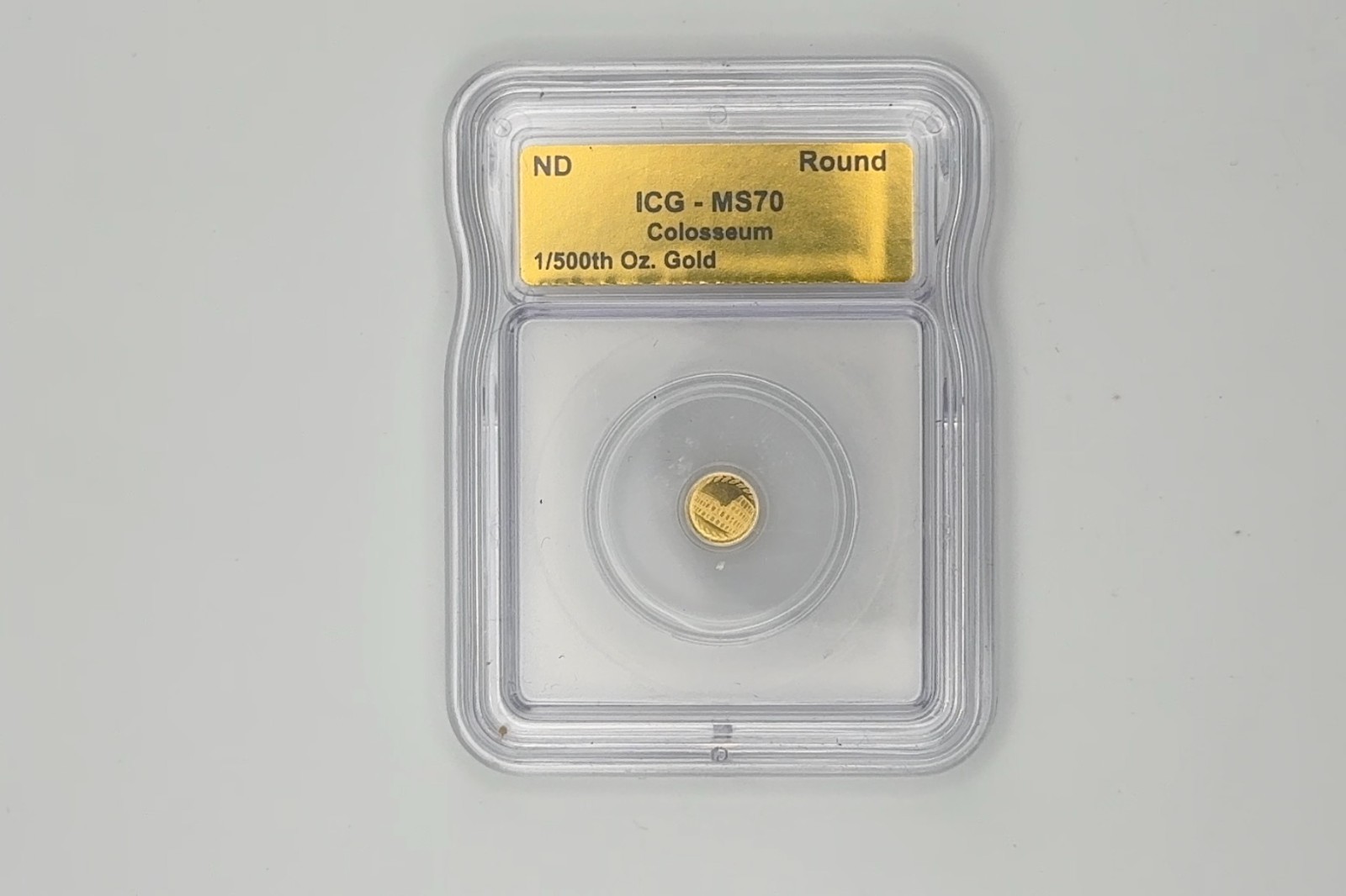 ICG MS70 Colosseum Gold Round 1/500th oz Gold Composition 1/500th oz