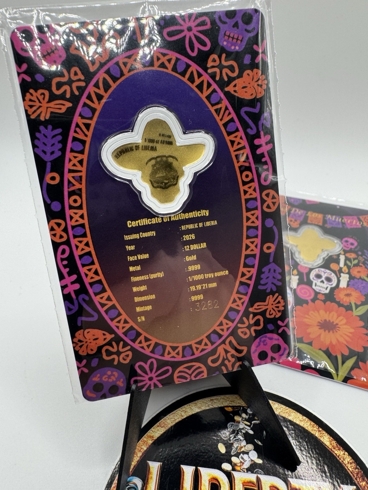 2026 Liberia 1/1000th Gold Carded Dia De Los Muertos Special Shaped with Capsule