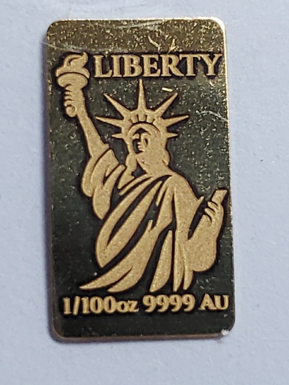 1/100th oz Gold Investment Bar. Statue Of Liberty