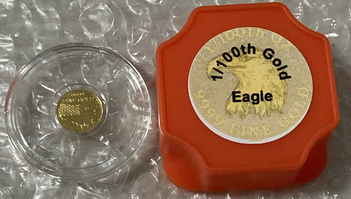 1/100 oz .9999 Fine Gold Round American Eagle & Flag in Clear Capsule – Monarch