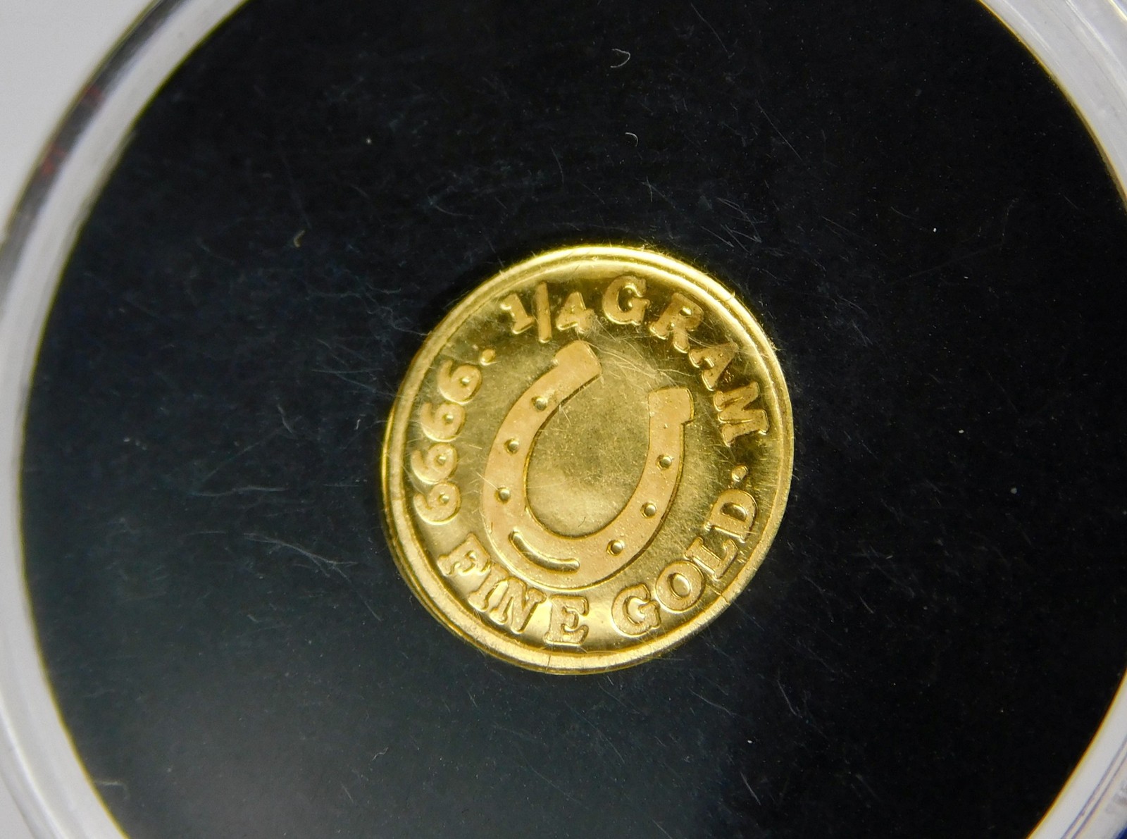 Monarch Precious Metals 1/4 Gram .9999 Fine Gold Lucky Horseshoe Round C