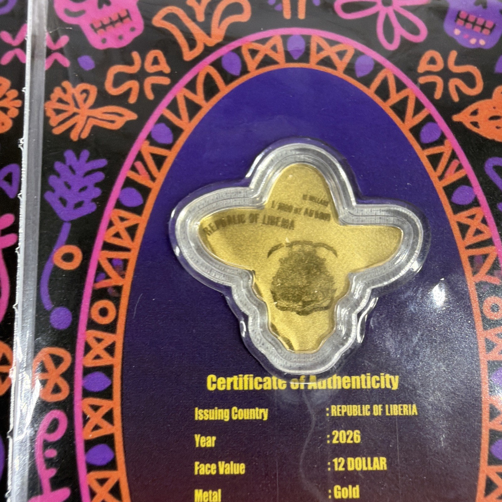 2026 Liberia 1/1000th Gold Carded Dia De Los Muertos Special Shaped with Capsule