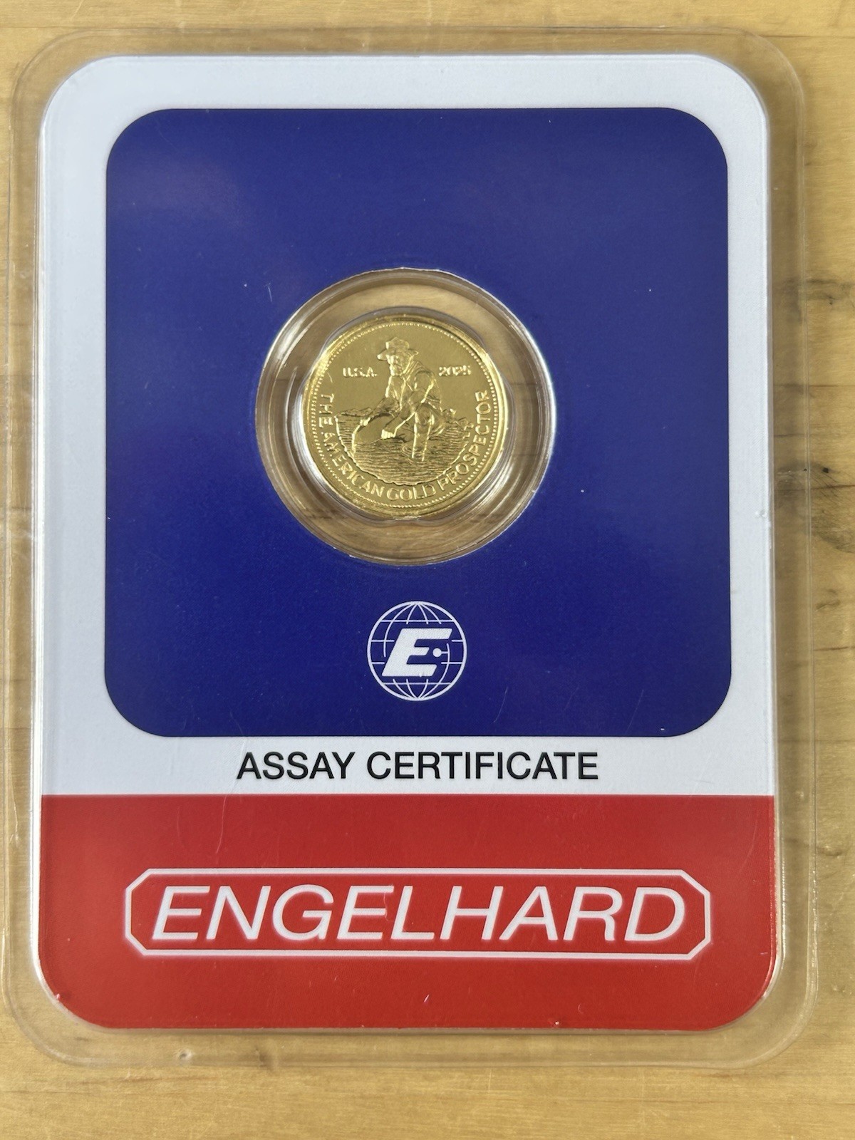 2025 Engelhard Gold 1/10 oz. – 999.9 Gold Prospector Round In Assay