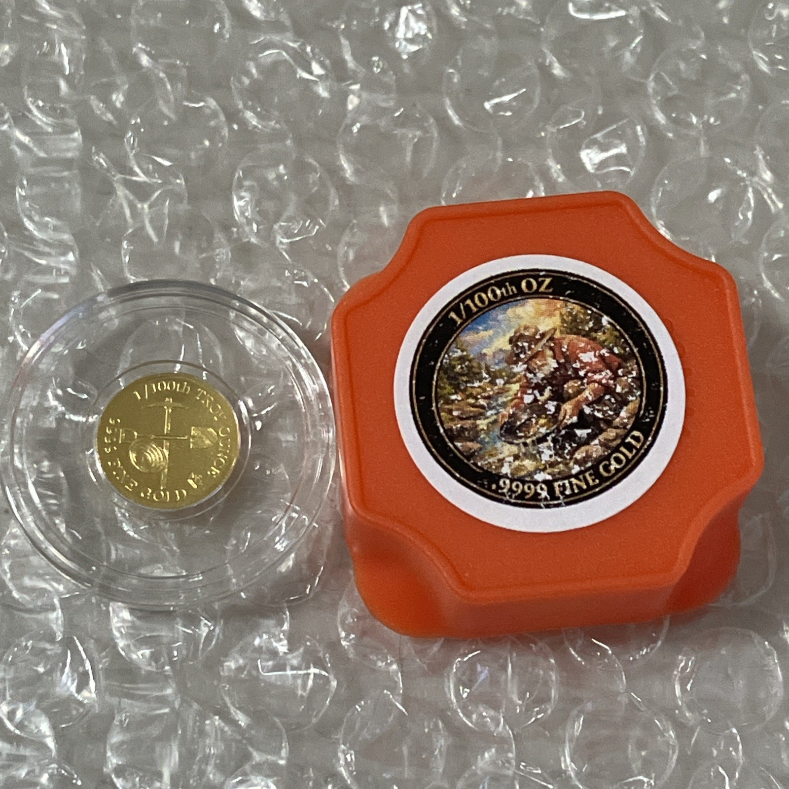 1/100th Troy ounce MONARCH .9999 Fine Gold Prospector Round in Clear Capsule