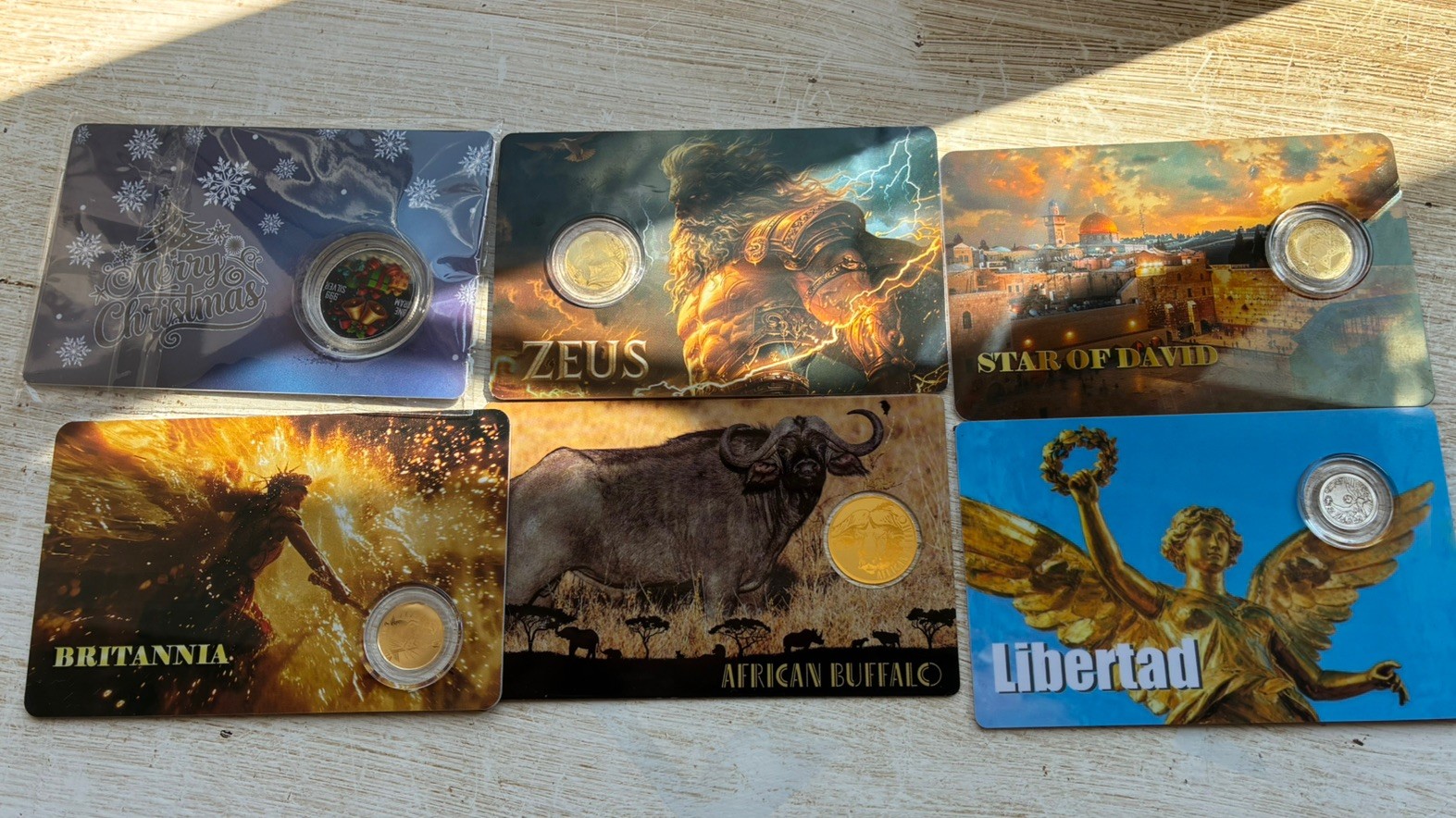 bundle 4x 1/1000th oz fractional gold, 1x silver, 1xPlatinum coin Zeus Brit