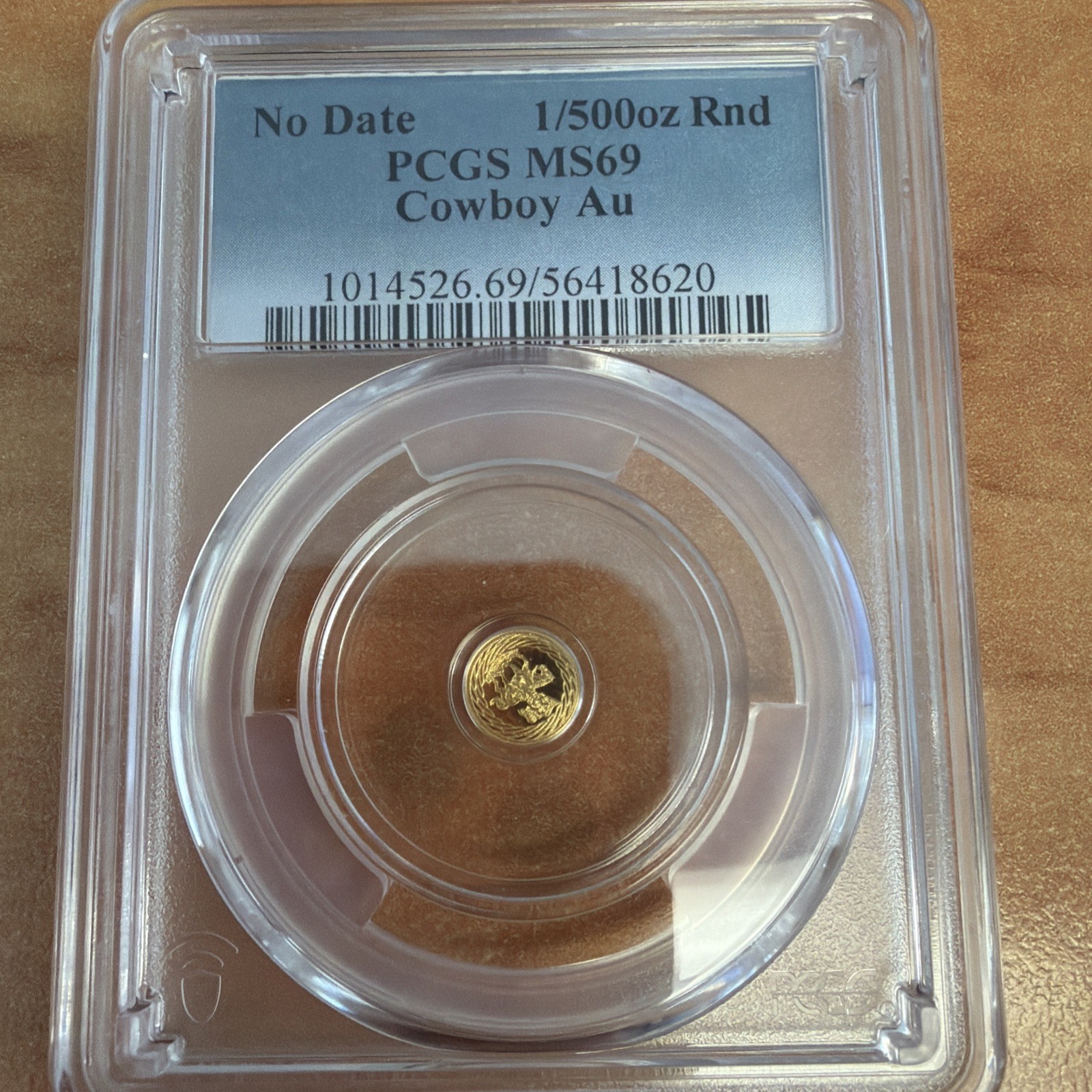 cowboy Au 1/500th oz Gold Round – Gold Composition – PCGS MS69 PCGS