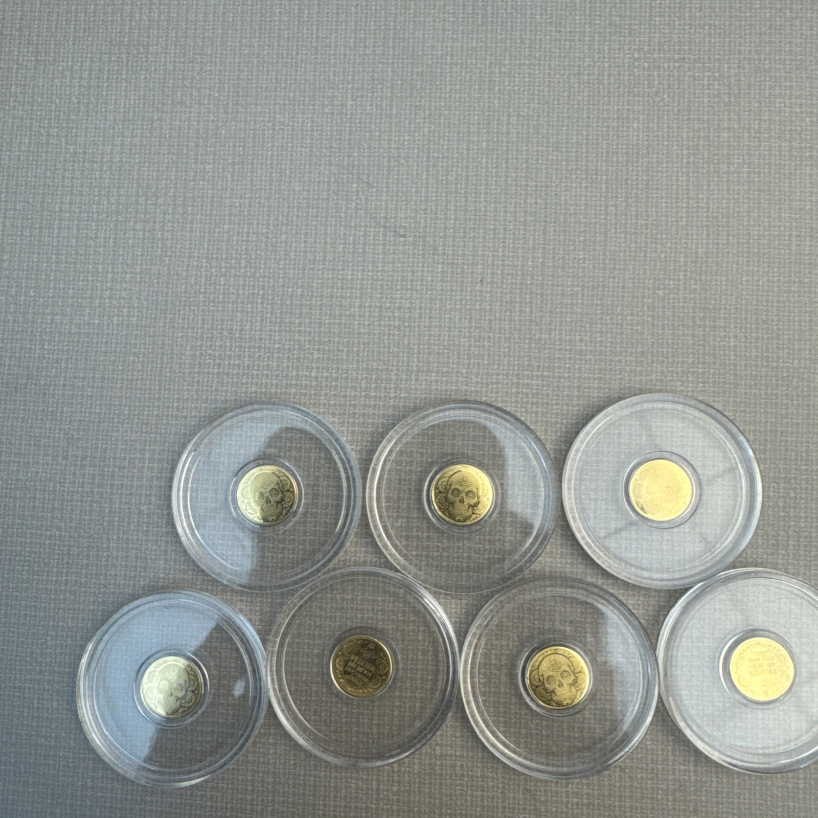 Pack of 7 1/200 oz .9999 Fine Gold Round Sugar Skull in Capsule Day of the Dead