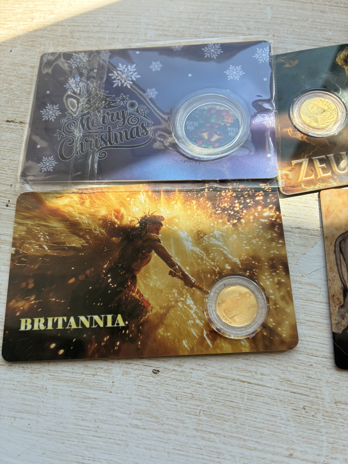 bundle 4x 1/1000th oz fractional gold, 1x silver, 1xPlatinum coin Zeus Brit