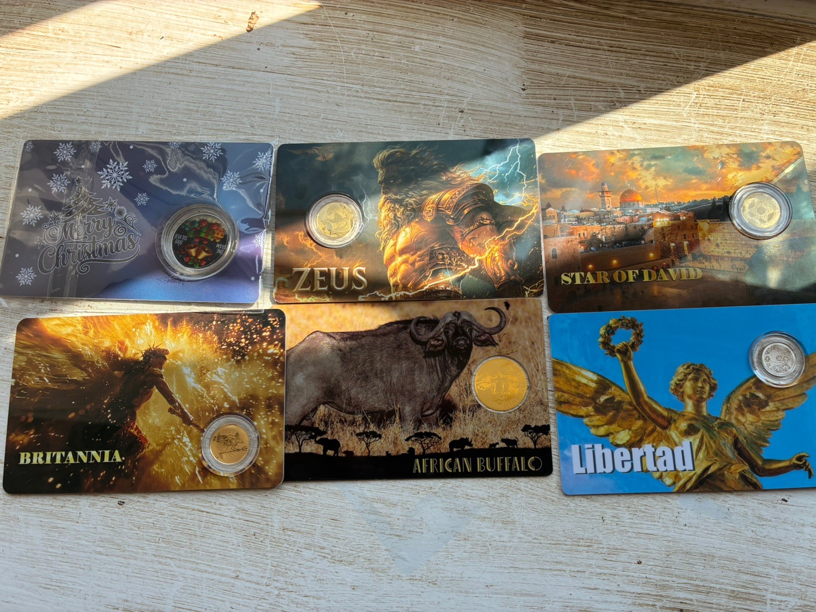 bundle 4x 1/1000th oz fractional gold, 1x silver, 1xPlatinum coin Zeus Brit