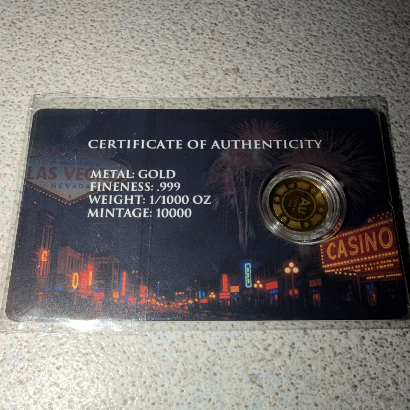 Roulette 1/1000 oz Gold Round In Card. Mintage 10,000