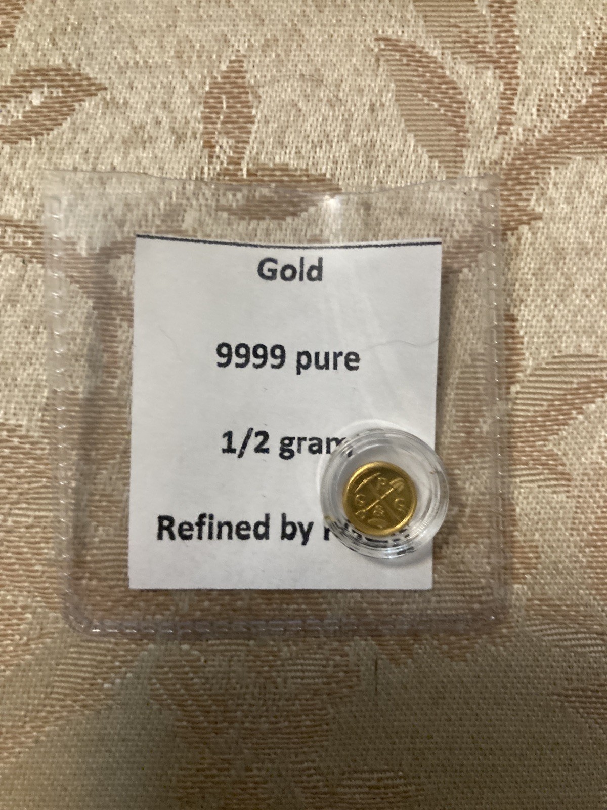 Prospector’s Gold & Gems half gram gold coin .5 gram Pg&g round
