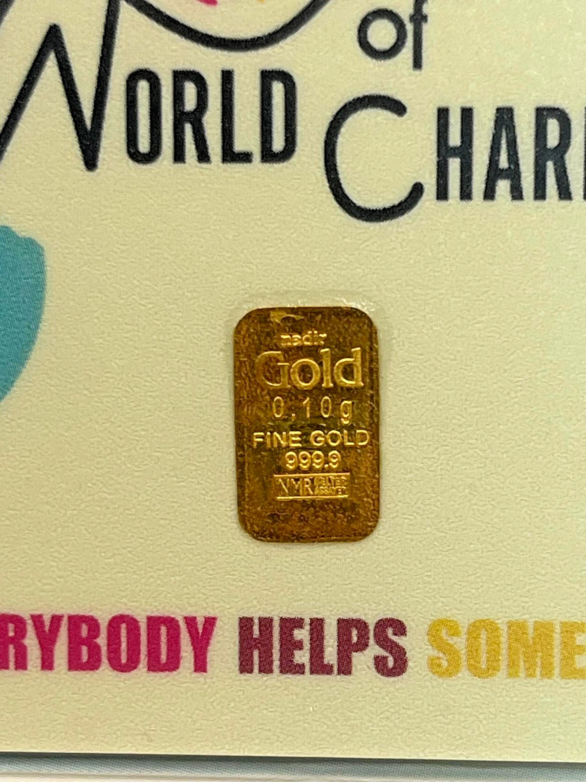 Gold Bar 1/10th gram gold bar World of Charity .999 GOLD .1 Karatbar