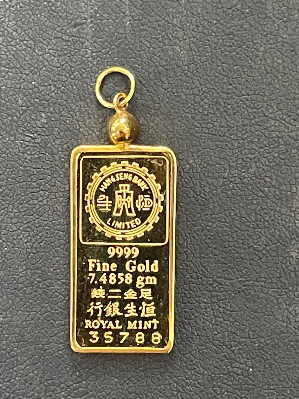 VINTAGE HANG SENG BANK ROYAL MINT 7.48gm. .9999 Gold “GOD OF WEALTH” BAR PENDANT