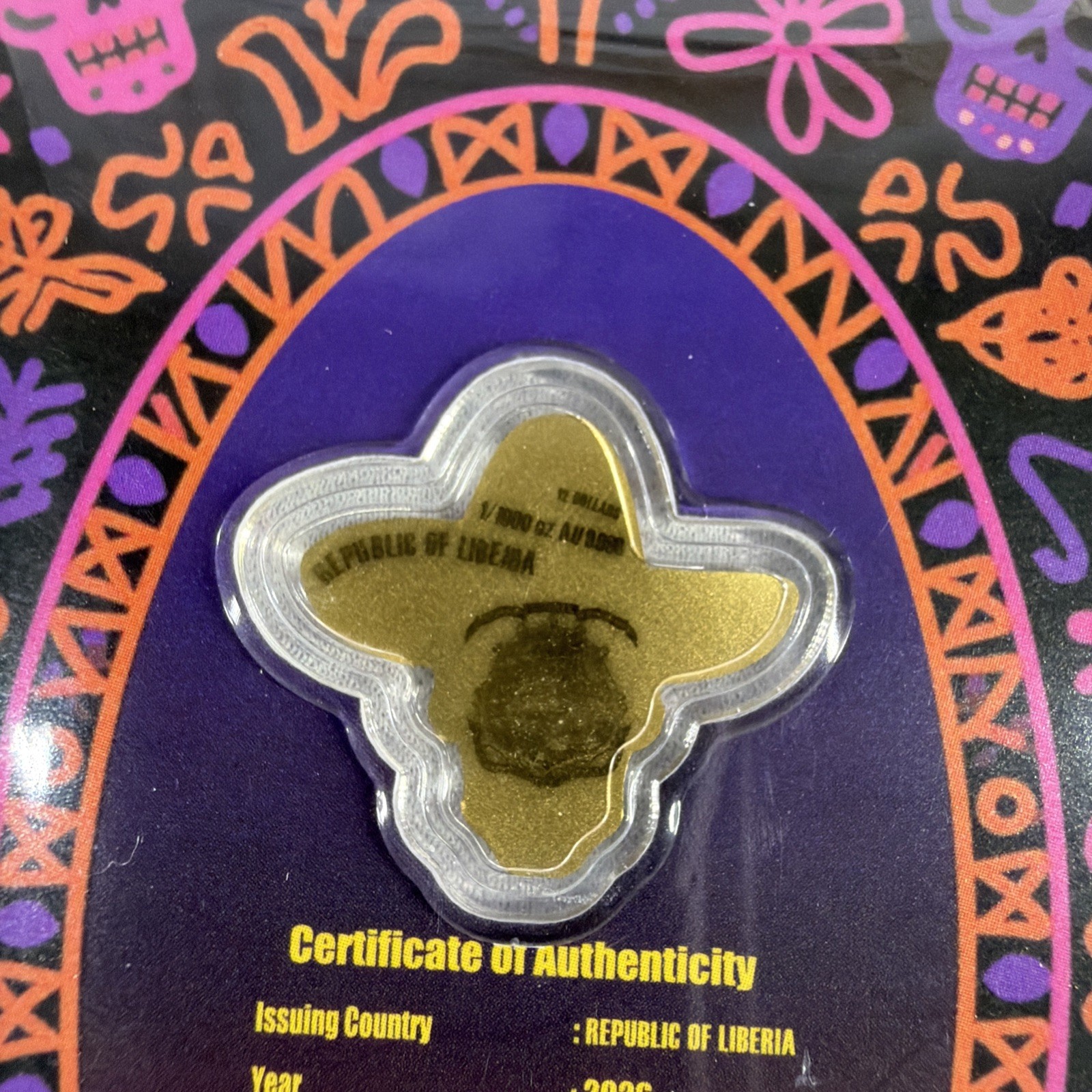 2026 Liberia 1/1000th Gold Carded Dia De Los Muertos Special Shaped with Capsule
