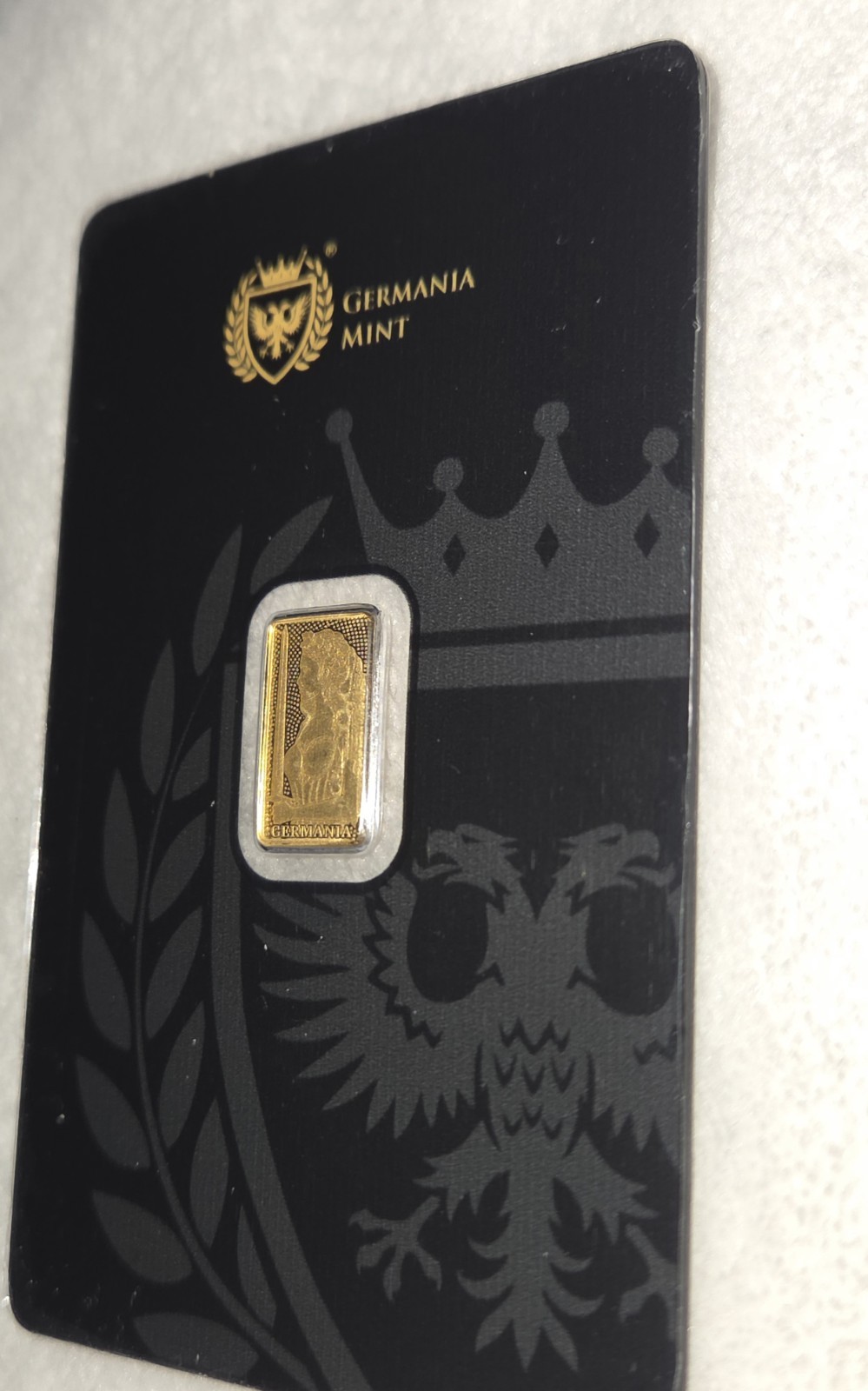 Germania Mint 1/100 Gold Lady Germania Stamped Proof Bar in Card