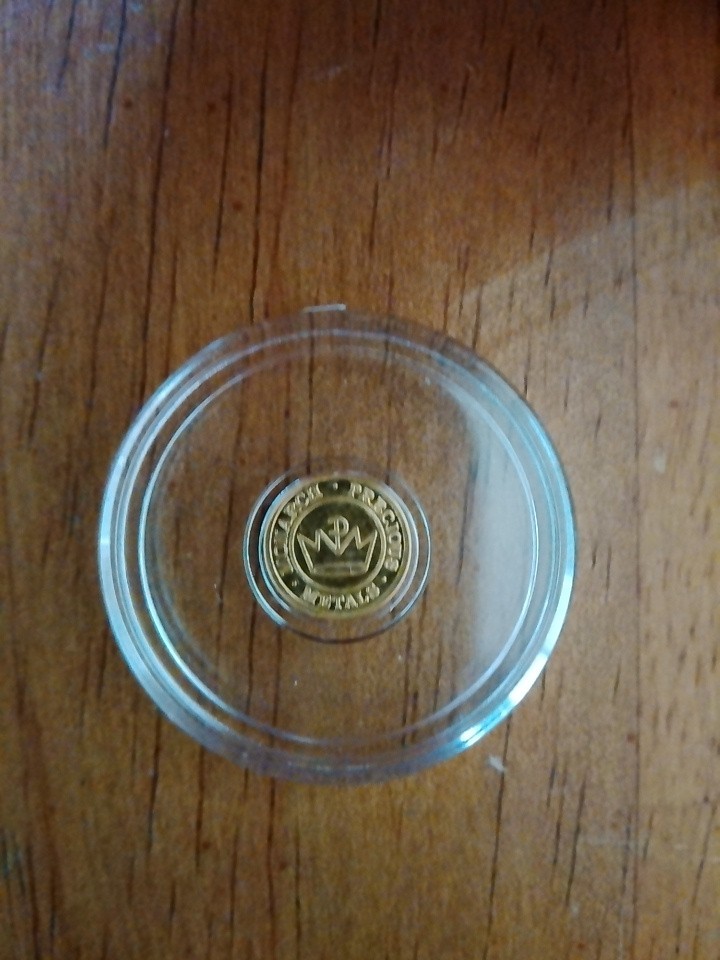 lot of 12. 1/4 GRAM .9999 FINE GOLD ROUNDS IN CAPSULES