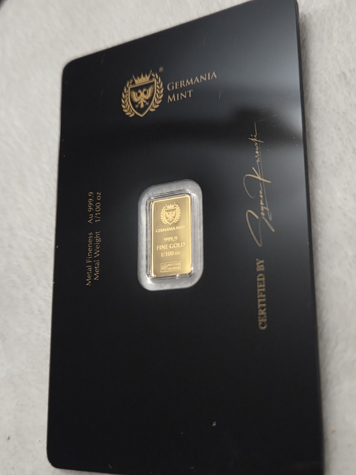 Germania Mint 1/100 Gold Lady Germania Stamped Proof Bar in Card