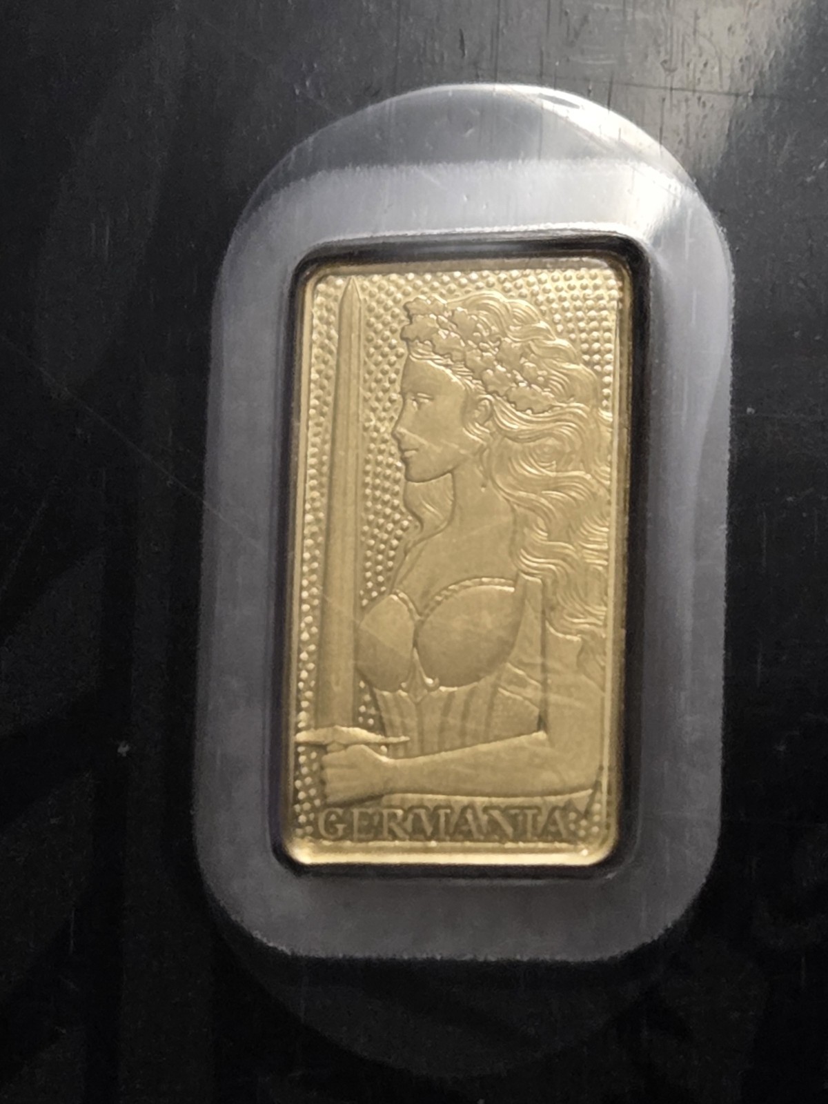 Germania Mint 1/100 Gold Lady Germania Stamped Proof Bar in Card