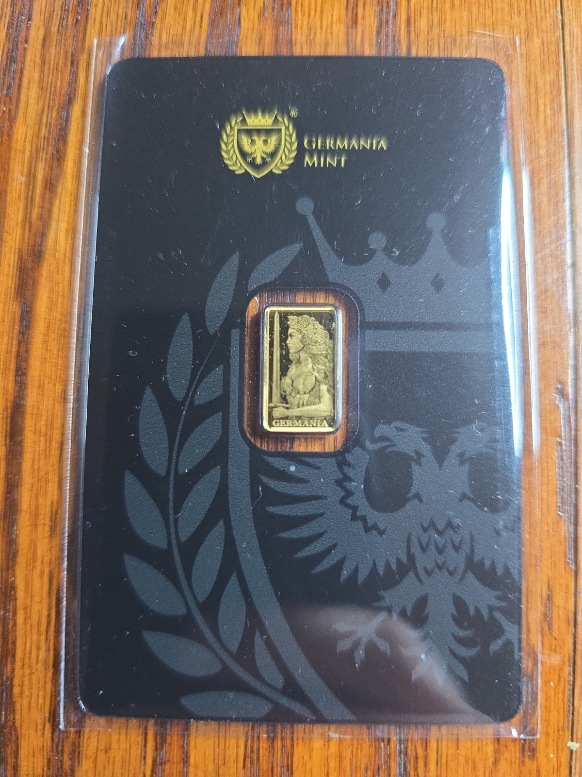 Germania Mint 1/100 oz 999.9 Fine Gold Stamped Bar in Assay Card