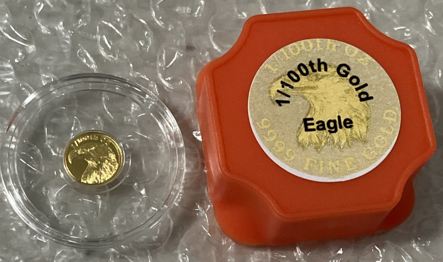 1/100 oz .9999 Fine Gold Round American Eagle & Flag in Clear Capsule – Monarch