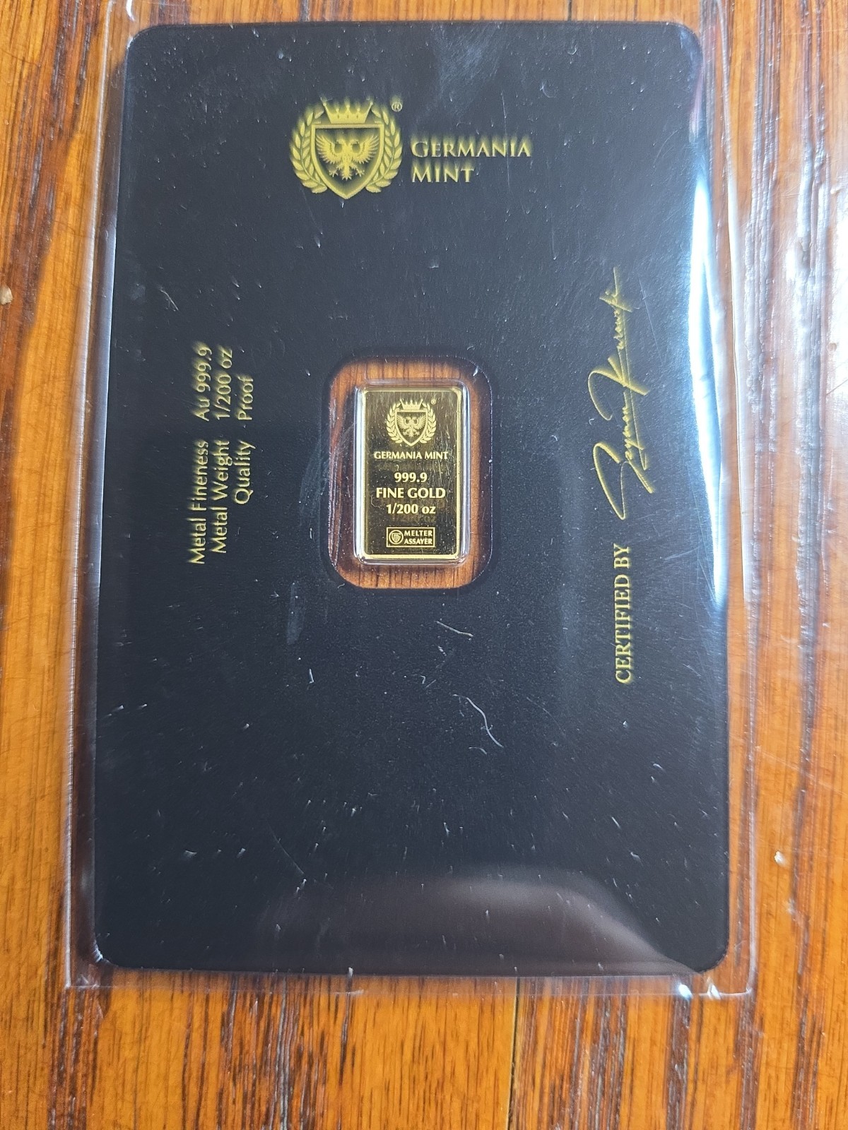Germania Mint 1/100 oz 999.9 Fine Gold Stamped Bar in Assay Card