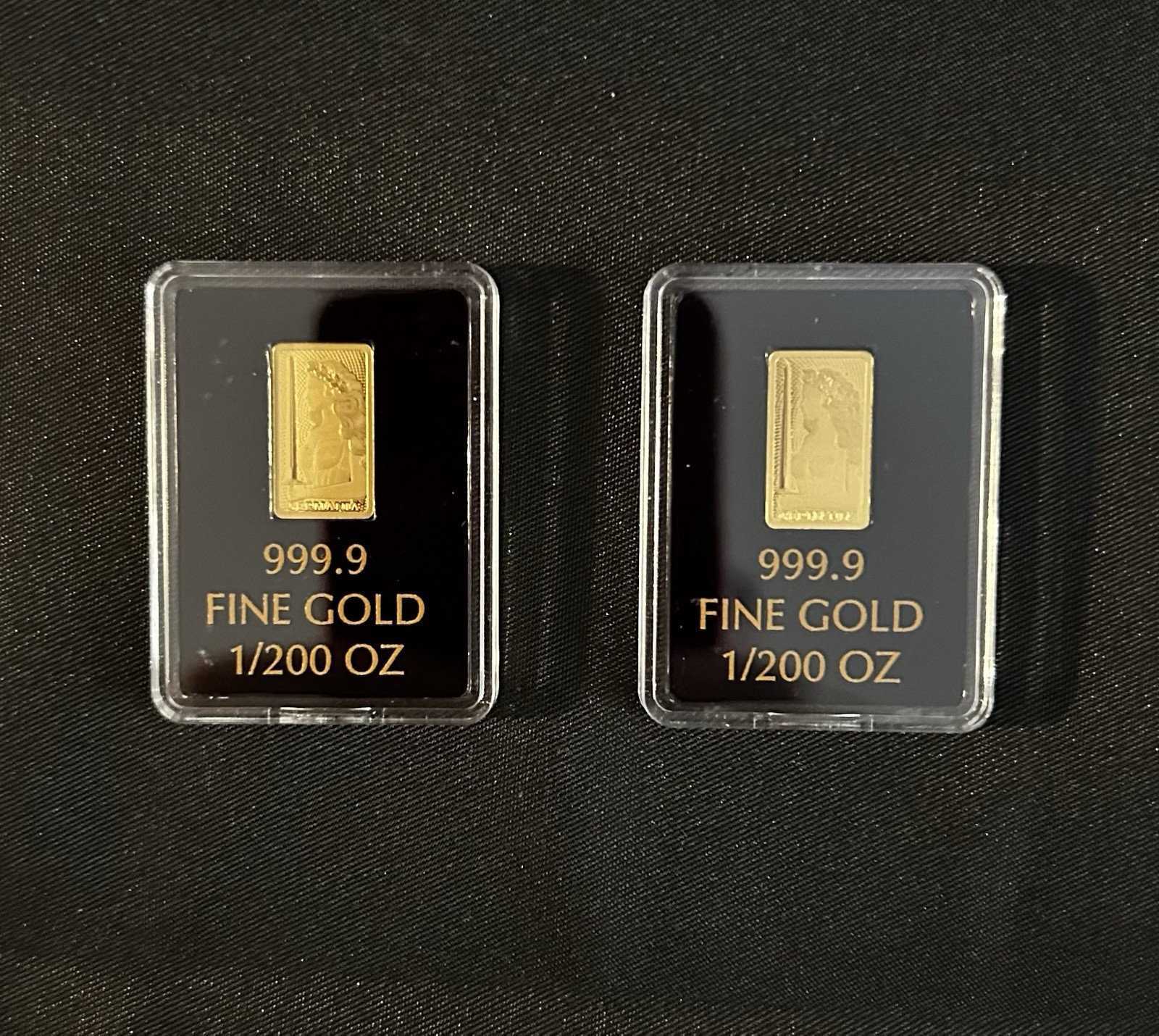 Lot of 2, 1/200th oz Germania Mint Gold In Capsules