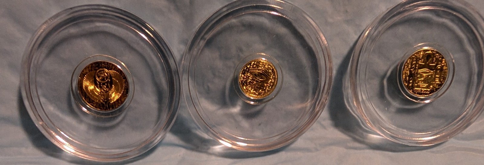 Lot of 3 .9999Pure Gold Rounds-2 1/200 oz Egyptian Scarab & 1 1/500 oz Eye of Ra